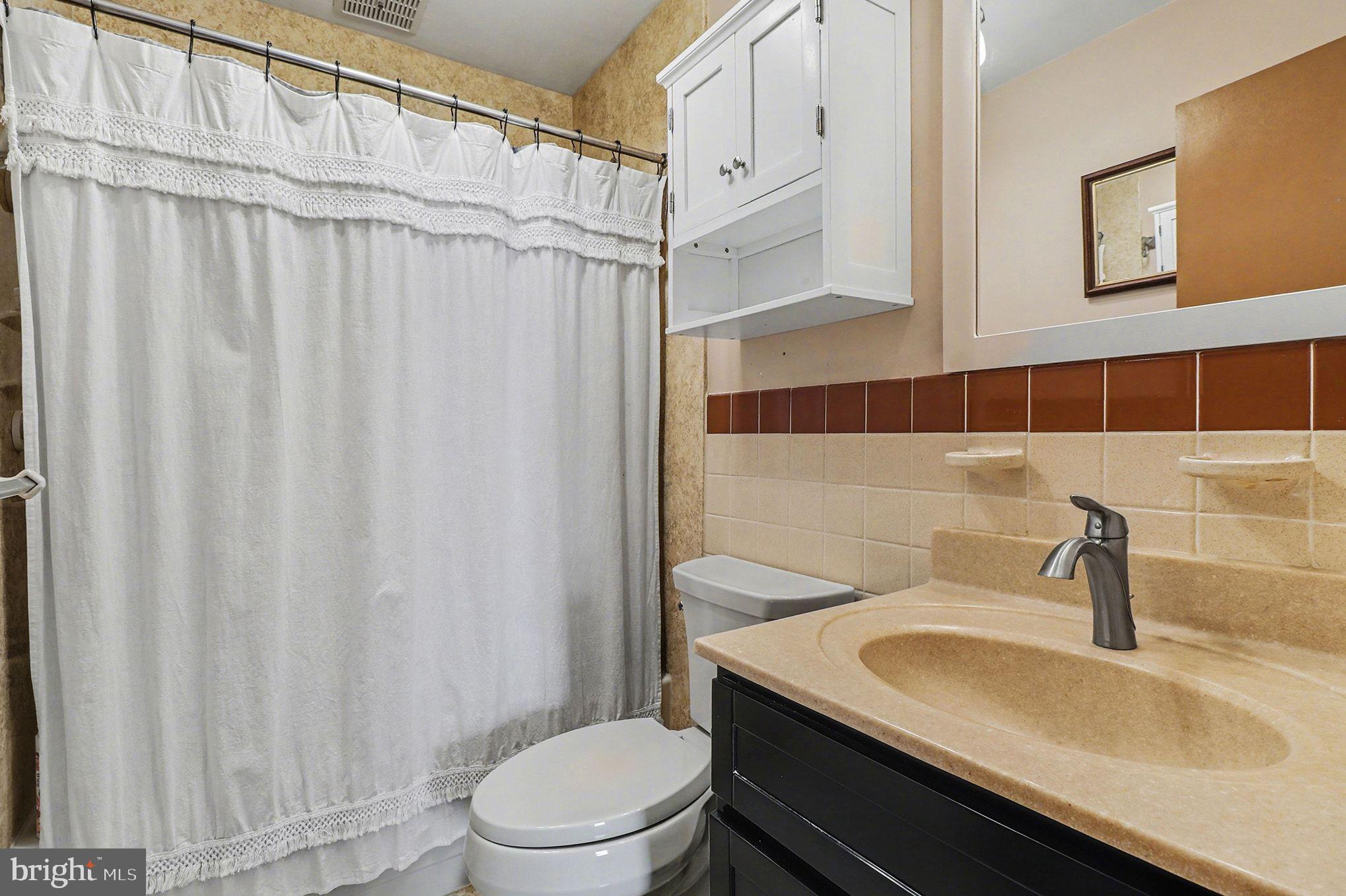 504 Hensley Street Lititz, PA 17543 - Photo 21 of 34 a bathroom with a sink toilet and shower