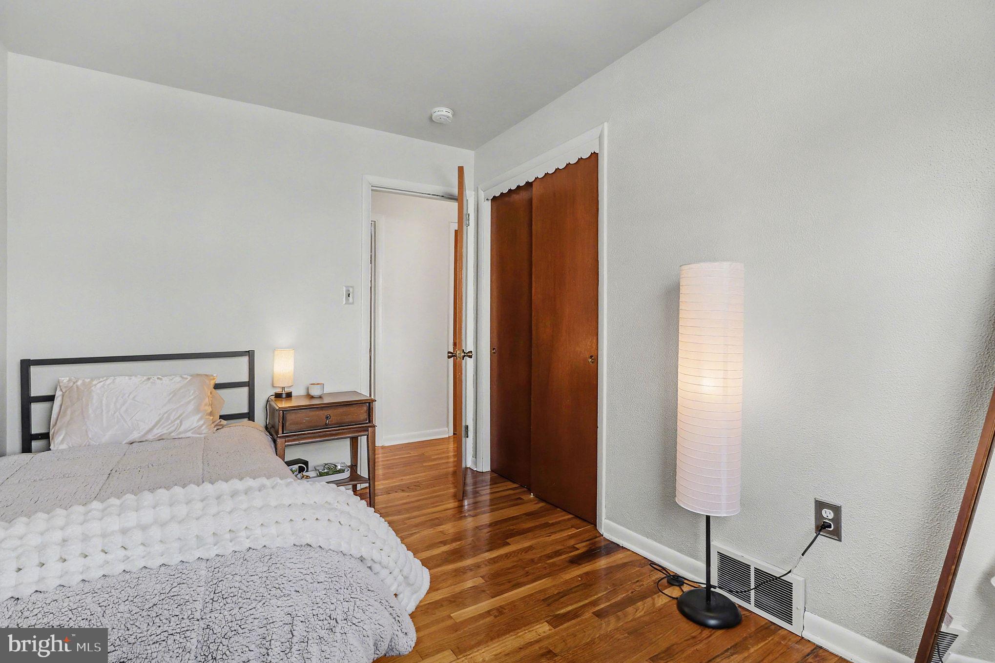 504 Hensley Street Lititz, PA 17543 - Photo 22 of 34 a bedroom with a bed and wooden floor