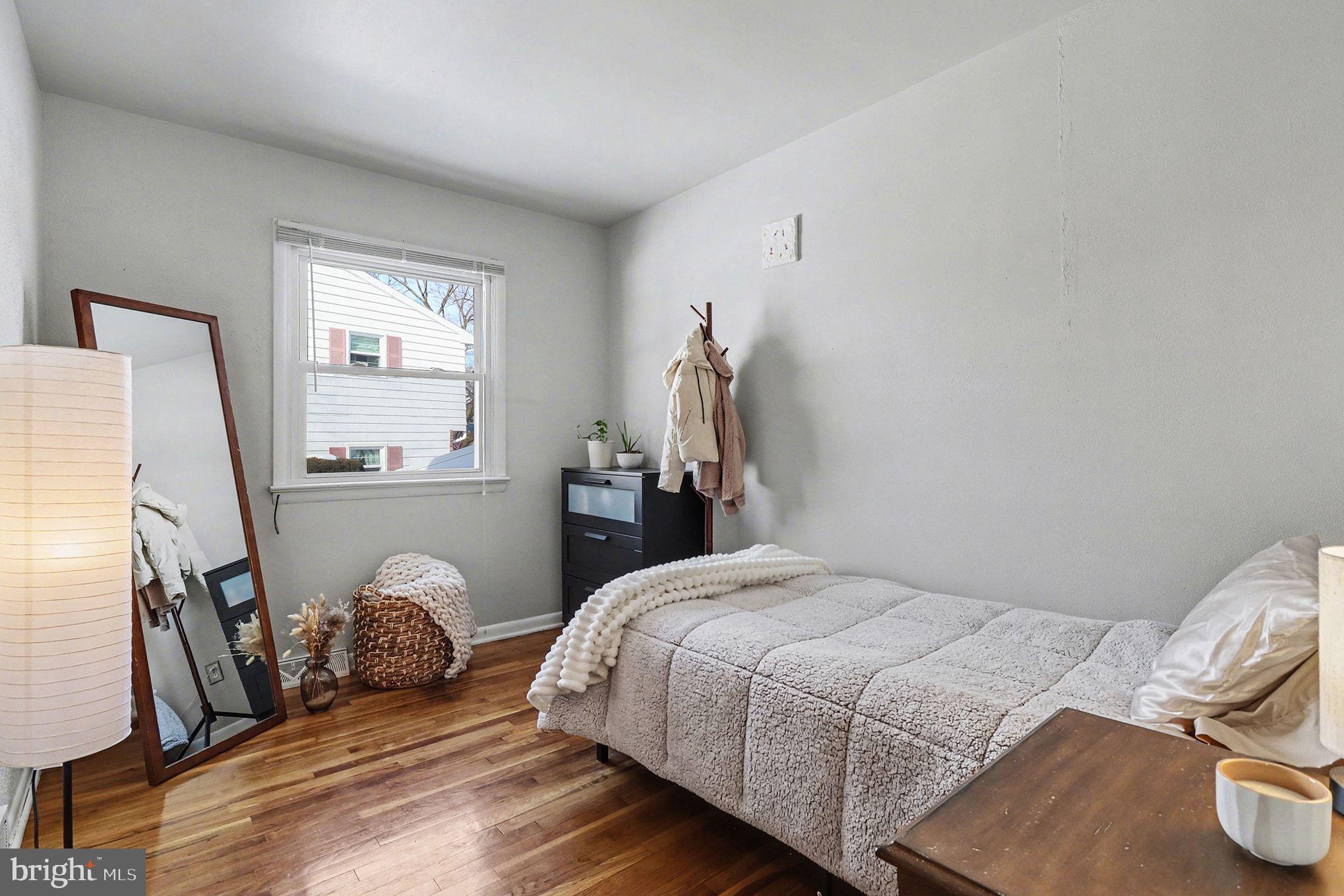 504 Hensley Street Lititz, PA 17543 - Photo 23 of 34 a bedroom with a bed and wooden floor