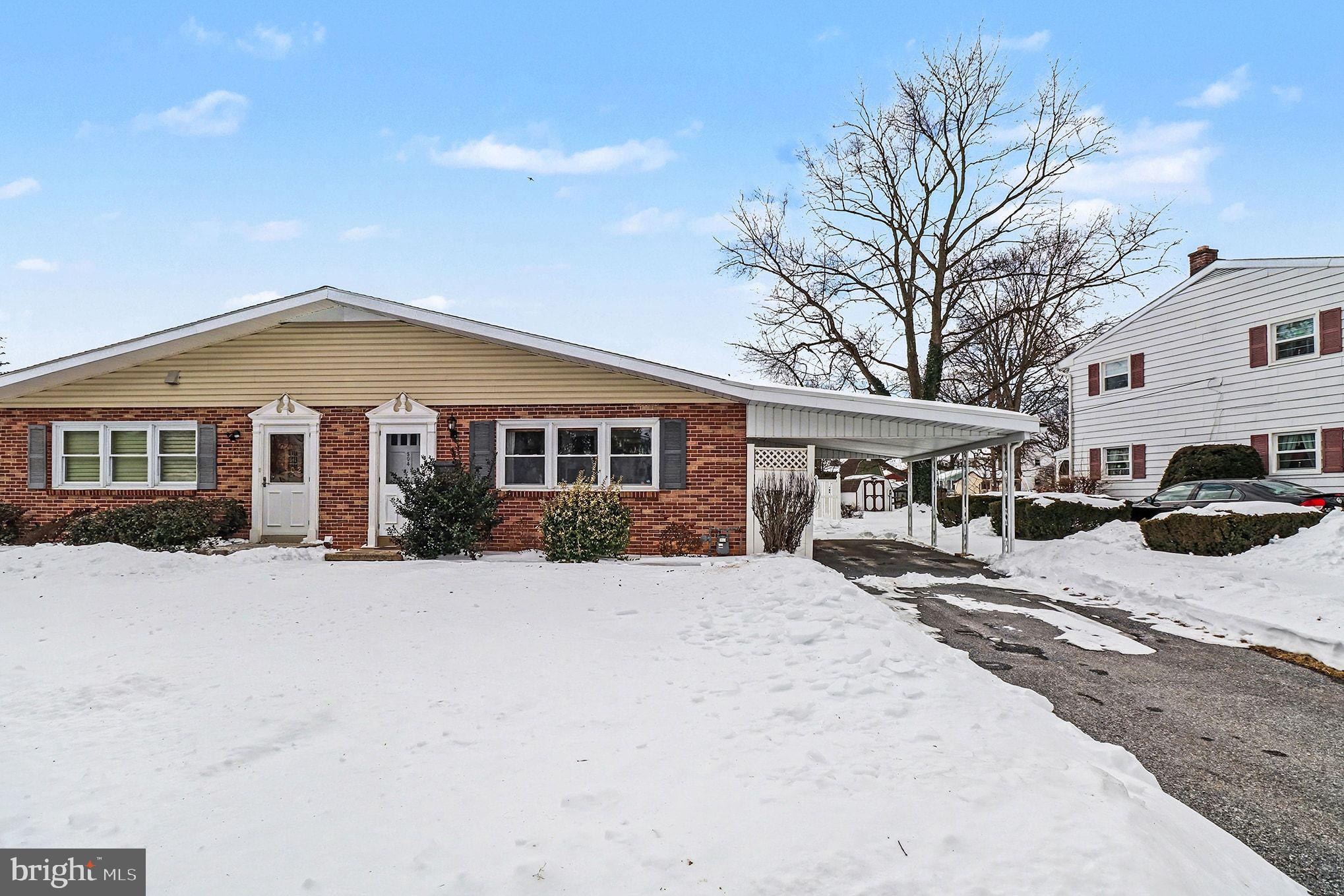 504 Hensley Street Lititz, PA 17543 - Photo 3 of 34 a front view of a house with yard covered in snow