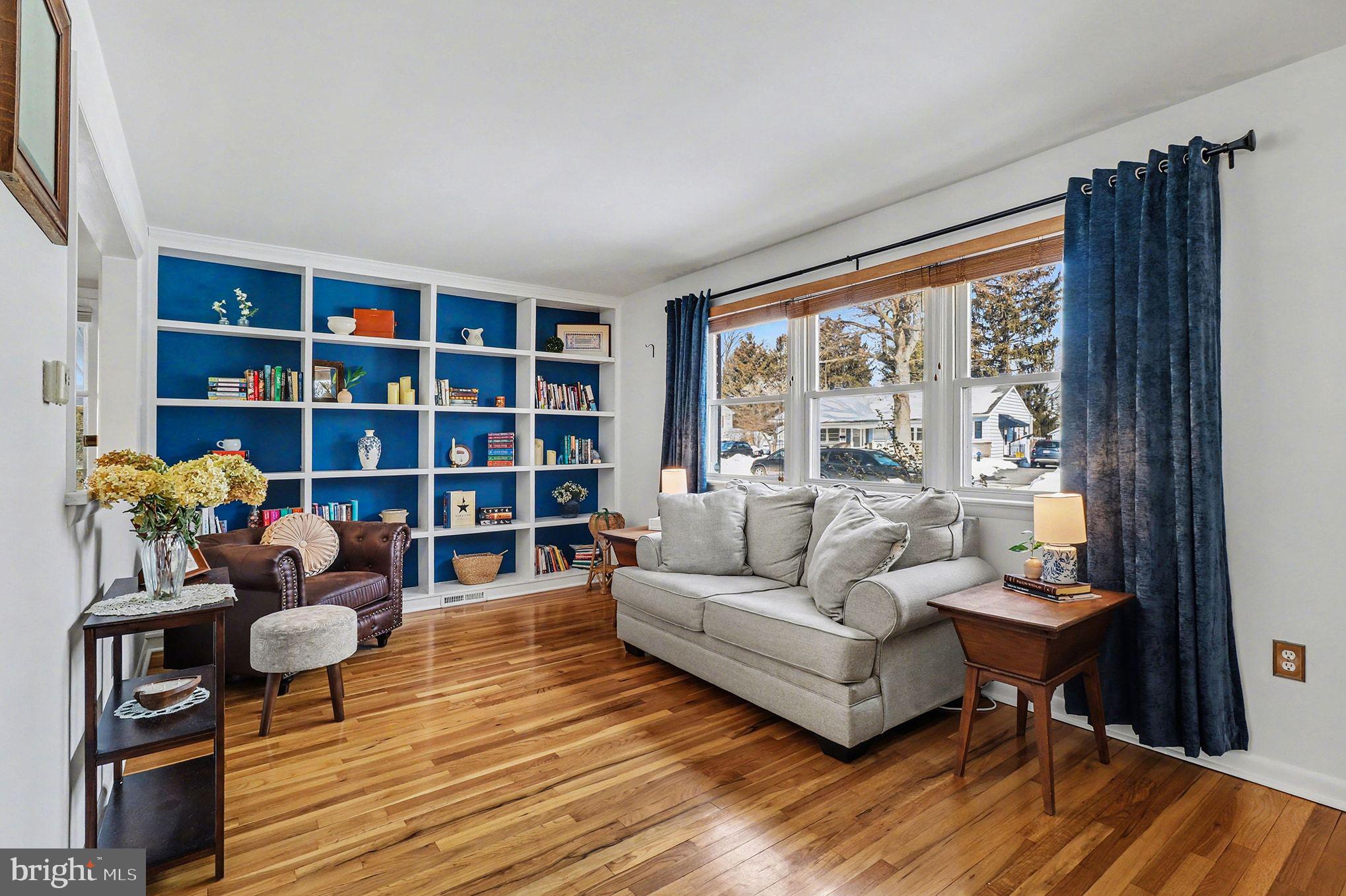 504 Hensley Street Lititz, PA 17543 - Photo 8 of 34 a living room with furniture and a book shelf