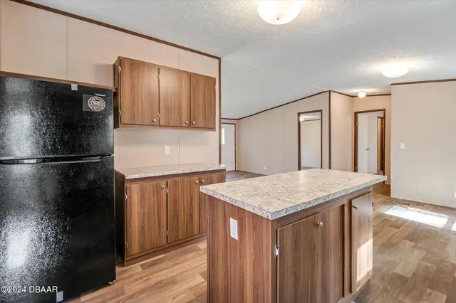 a room with a window and wooden floor