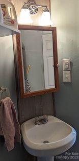 180 Sunset Drive Rutherfordton, NC 28139 - Photo 11 of 44 a bathroom with a sink and mirror