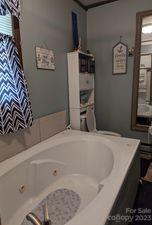 180 Sunset Drive Rutherfordton, NC 28139 - Photo 13 of 44 a bathroom with a bathtub and shower