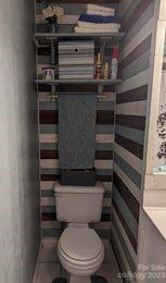 180 Sunset Drive Rutherfordton, NC 28139 - Photo 20 of 44 a bathroom with a toilet and a shower