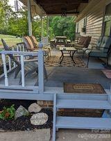 180 Sunset Drive Rutherfordton, NC 28139 - Photo 2 of 44 a view of a house with backyard sitting area and garden