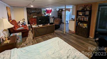 180 Sunset Drive Rutherfordton, NC 28139 - Photo 26 of 44 a bed room with a bed and a television