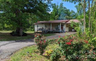 180 Sunset Drive Rutherfordton, NC 28139 - Photo 38 of 44 a front view of a house with yard and green space