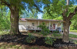 180 Sunset Drive Rutherfordton, NC 28139 - Photo 39 of 44 a front view of house with yard and outdoor seating