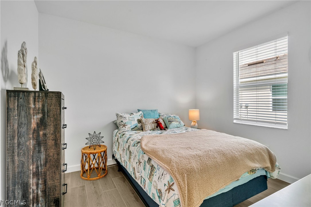 17388 Walnut Run Drive Alva, FL 33920 - Photo 15 of 24 a bedroom with a bed and a window