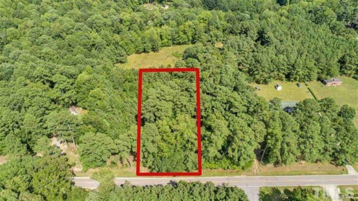 780 Richardson Road Zebulon, NC 27597 - Photo 5 of 6 a sign that is sitting in front of a tree