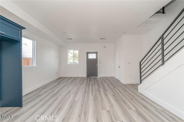6375 Converse Avenue, Unit A Los Angeles, CA 90001 - Photo 1 of 14 a view of wooden floor and windows in a room