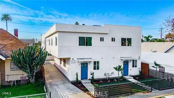 a aerial view of a house with a yard