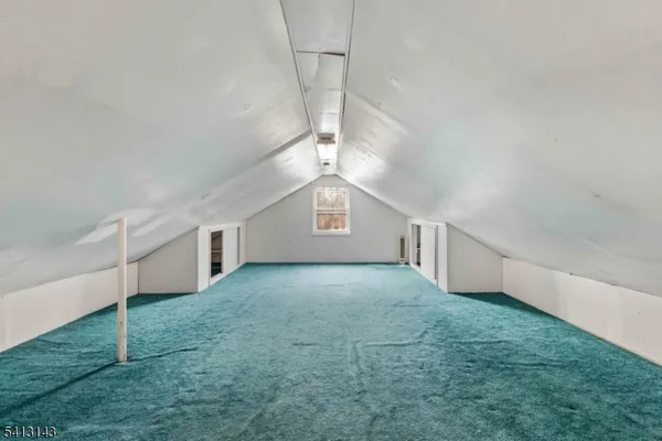 a view of a big room with windows and cabinet