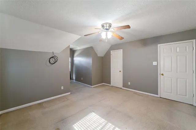 a bathroom with a shower and a toilet