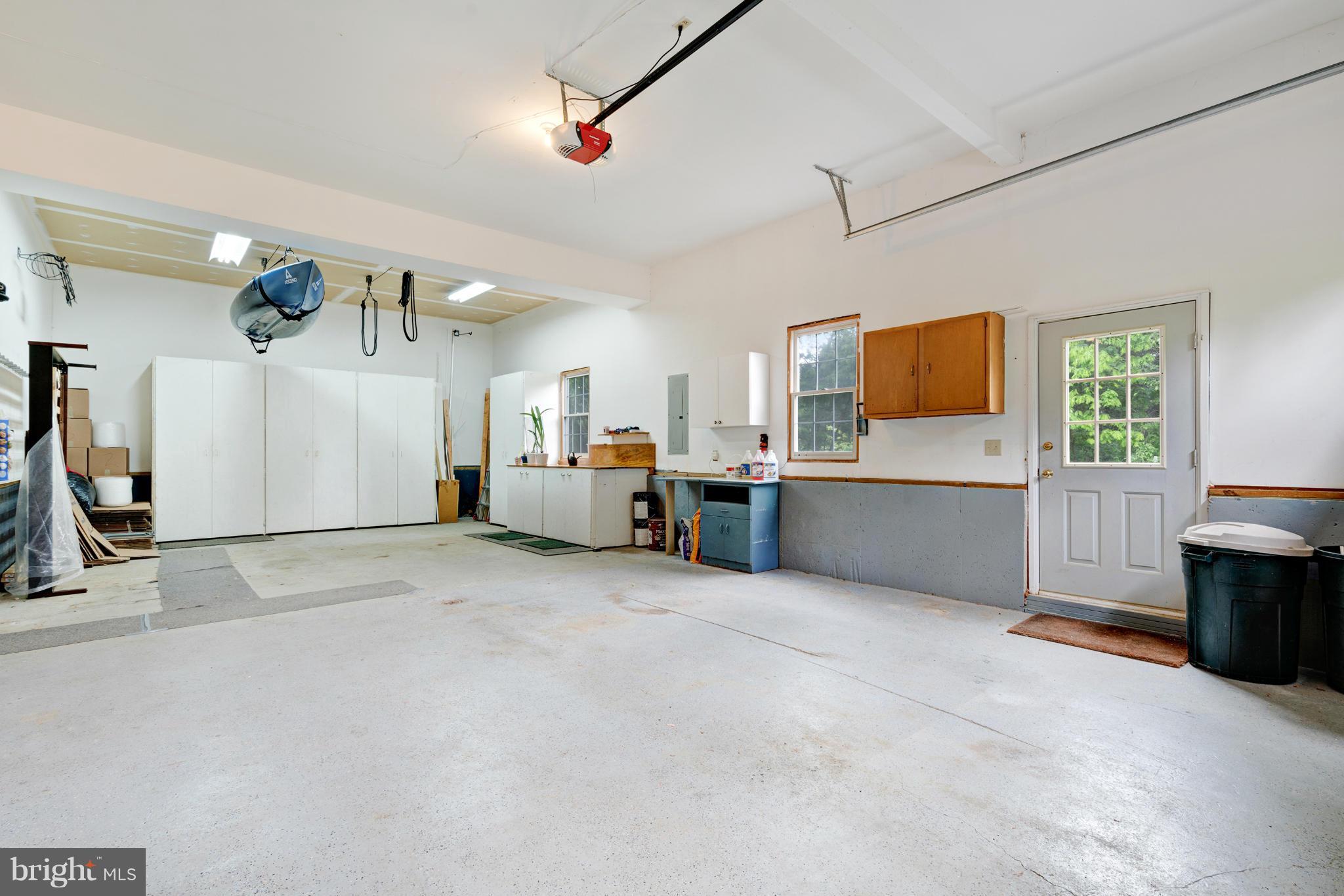 7103 Kelly Road Warrenton, VA 20187 - Photo 14 of 30 Workbench and cabinets in garage