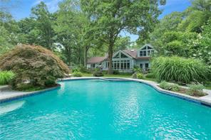 81 East Ridge Road Waccabuc, NY 10597 - Photo 1 of 1 a view of a house with a swimming pool