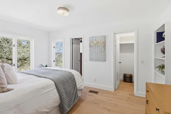 a bedroom with a bed and a cabinets