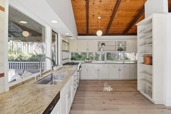 a kitchen with counter top space and stainless steel appliances