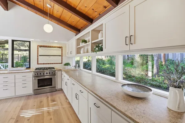 a kitchen with sink and stove