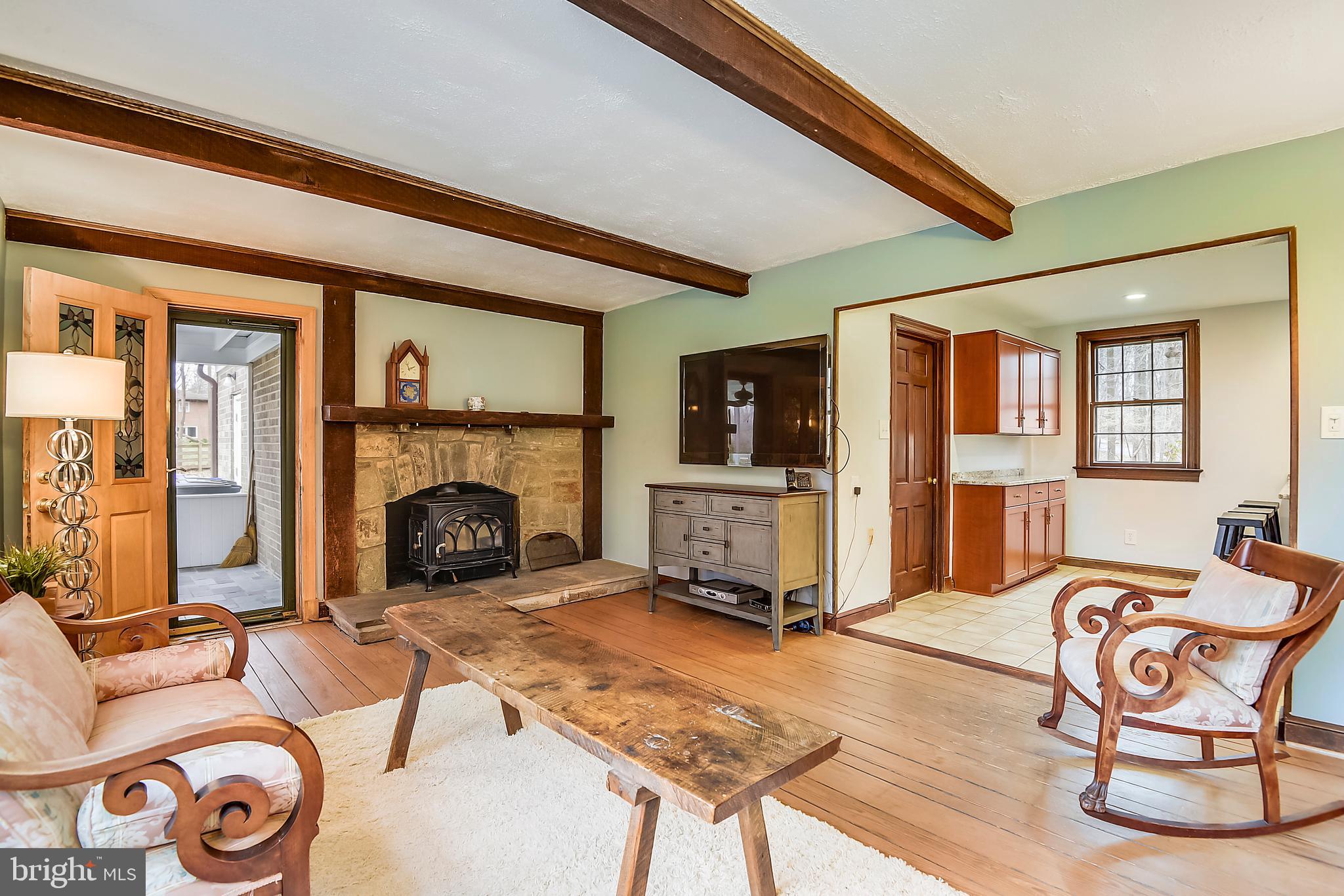 17717 Pond Road Ashton, MD 20861 - Photo 14 of 51 family room with wood burning stone fireplace