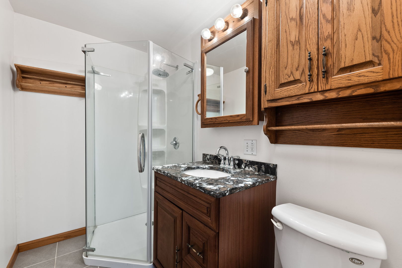 531 South Hieland Road St. Anne, IL 60964 - Photo 14 of 45 a bathroom with a sink a toilet and shower