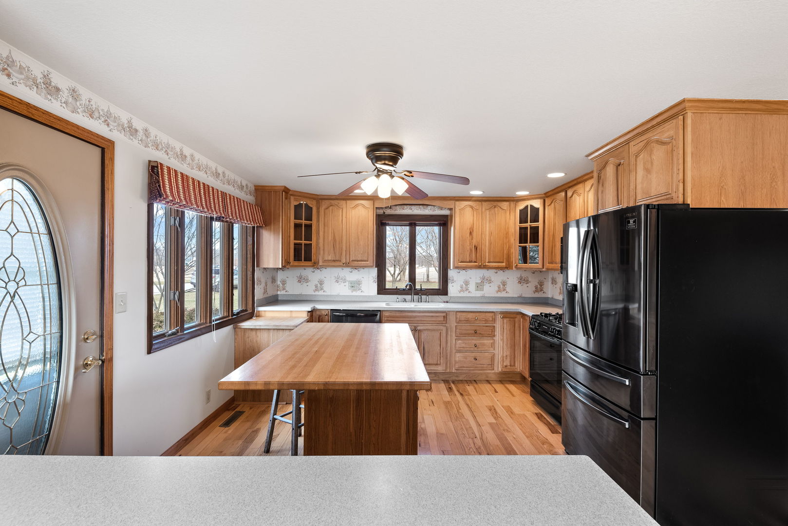 531 South Hieland Road St. Anne, IL 60964 - Photo 5 of 45 a kitchen with stainless steel appliances granite countertop a refrigerator and a stove