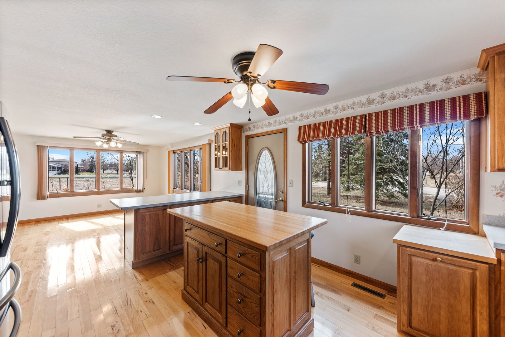 531 South Hieland Road St. Anne, IL 60964 - Photo 6 of 45 a living room with stainless steel appliances granite countertop furniture and a large window