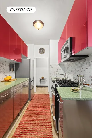 a kitchen with stainless steel appliances granite countertop a stove and a sink