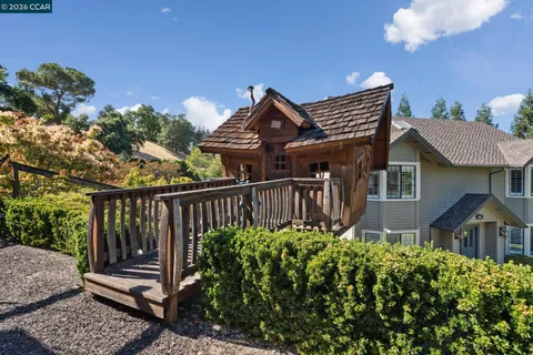 an aerial view of a house with a yard basket ball court and outdoor seating