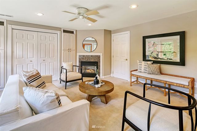 a living room with furniture a window and a fireplace
