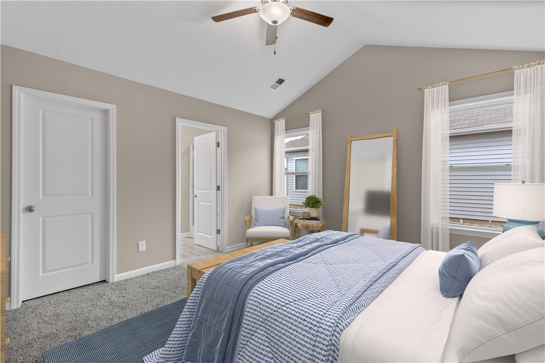 209 Celebration Avenue Anderson, SC 29625 - Photo 14 of 36 This spacious bedroom offers high vaulted ceilings and plush carpeting.