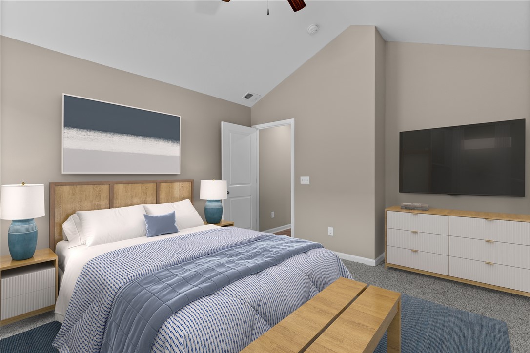 209 Celebration Avenue Anderson, SC 29625 - Photo 15 of 36 This spacious bedroom offers comfort with vaulted ceilings and soft carpeting.