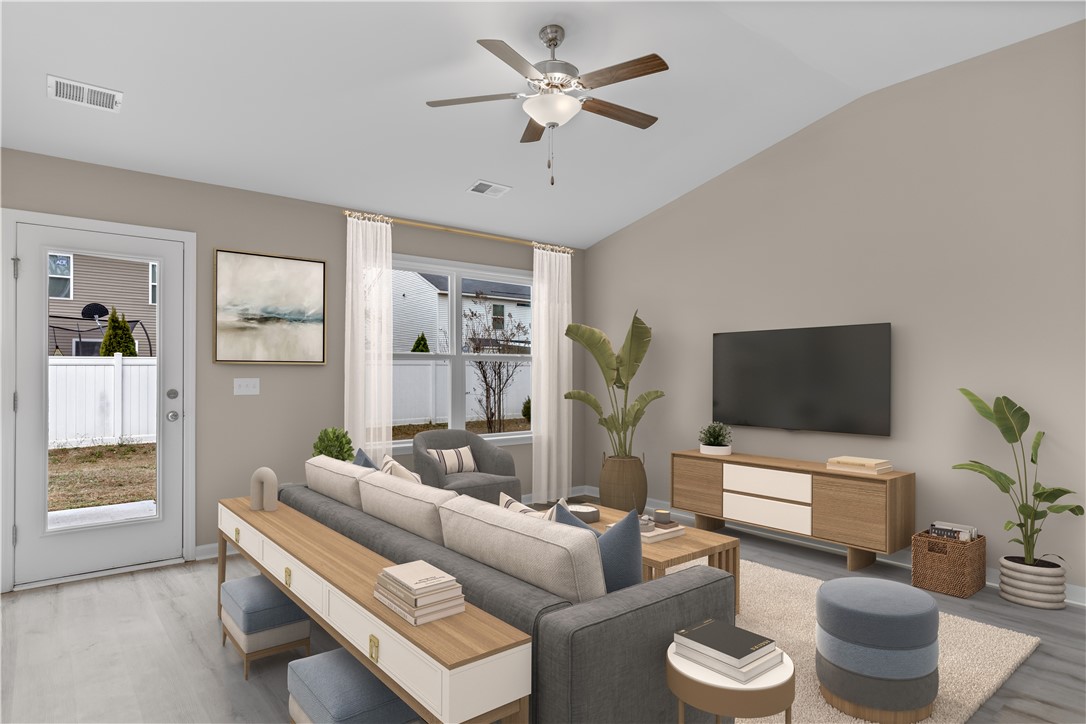 209 Celebration Avenue Anderson, SC 29625 - Photo 8 of 36 This bright living space features abundant natural light and soaring ceilings.