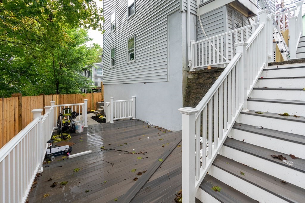 9-13 Sutherland Road, Unit 2 Arlington, MA 02476 - Photo 12 of 15 a view of a balcony with chair