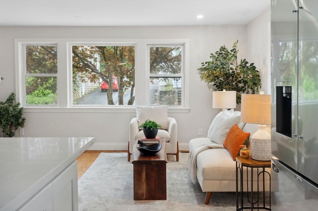 9-13 Sutherland Road, Unit 2 Arlington, MA 02476 - Photo 6 of 15 a living room with furniture and a large window