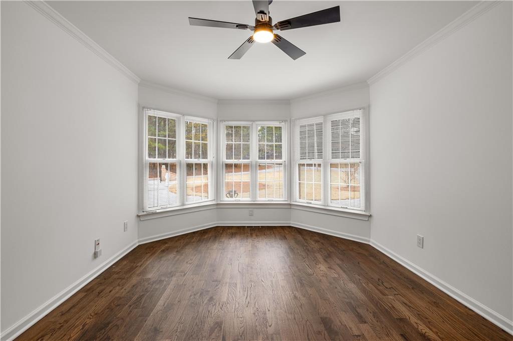 5302 Greenway Drive Villa Rica, GA 30180 - Photo 20 of 79 an empty room with wooden floor and windows