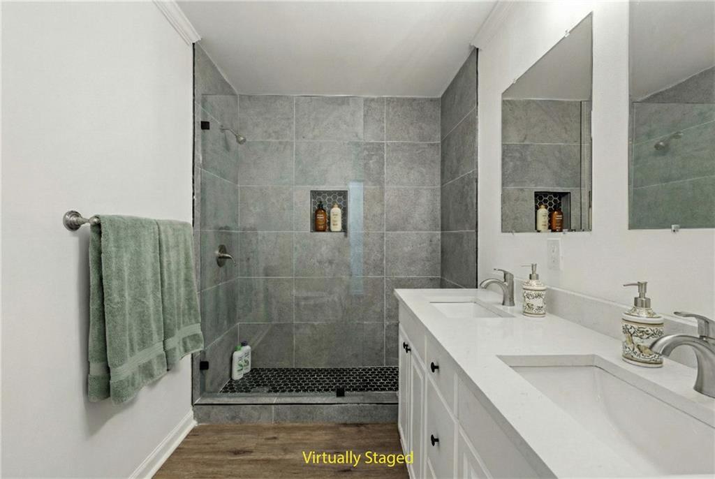 5302 Greenway Drive Villa Rica, GA 30180 - Photo 27 of 81 a bathroom with a sink a toilet and shower