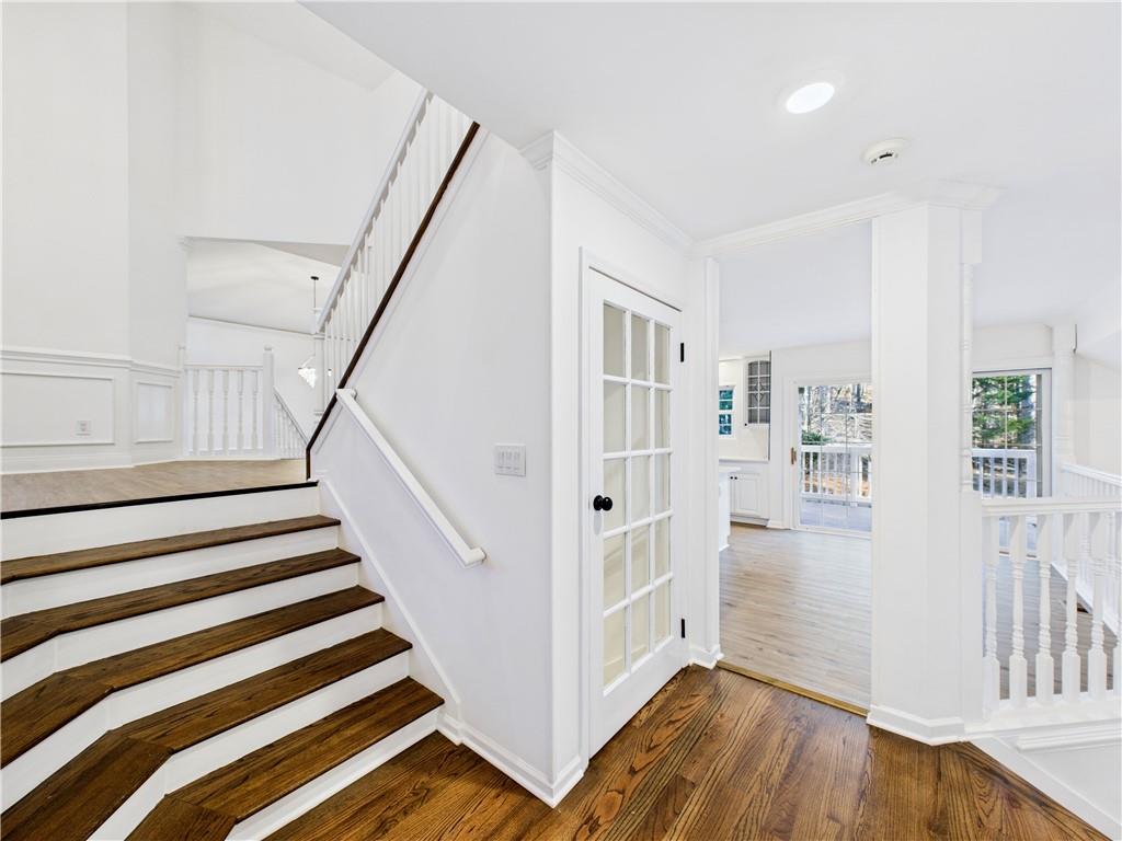 5302 Greenway Drive Villa Rica, GA 30180 - Photo 27 of 79 a view of a hallway with wooden floor and stairs