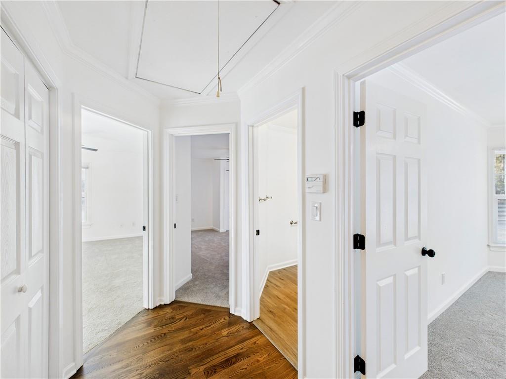 5302 Greenway Drive Villa Rica, GA 30180 - Photo 38 of 79 a view of a bedroom with a bed and wooden floor
