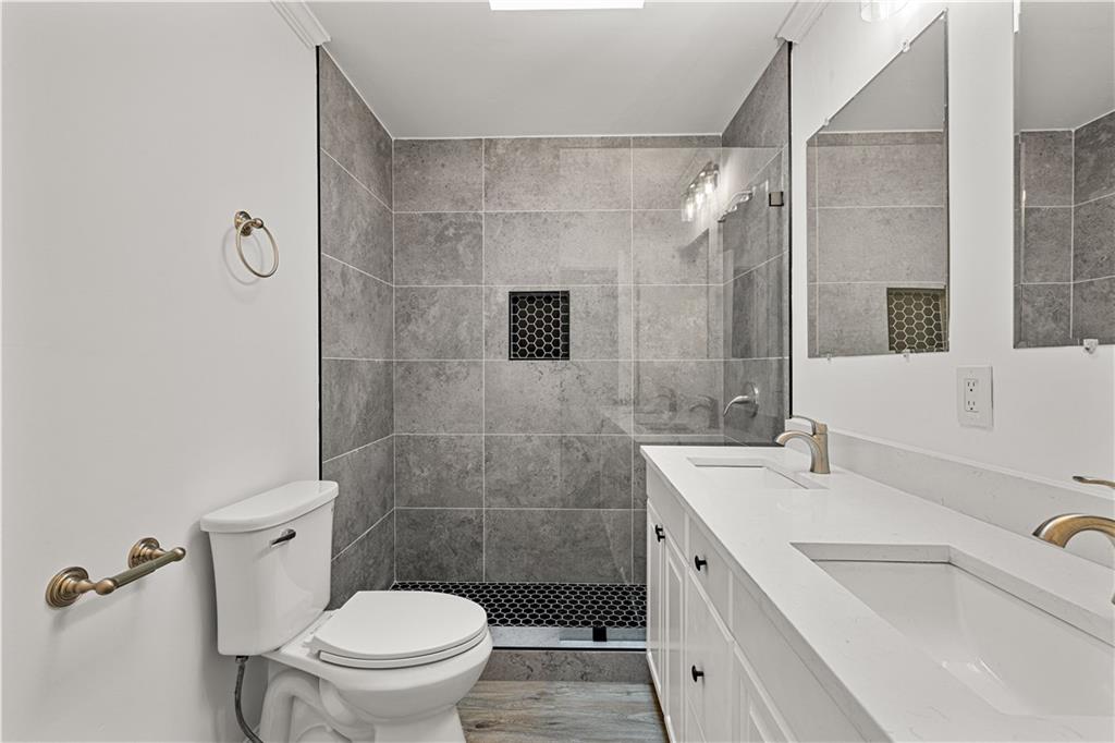 5302 Greenway Drive Villa Rica, GA 30180 - Photo 46 of 79 a bathroom with a sink a toilet and shower