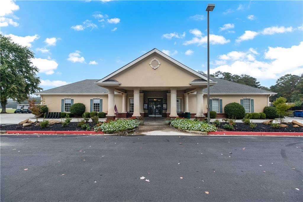 5302 Greenway Drive Villa Rica, GA 30180 - Photo 77 of 81 a front view of a house with a garden and plants