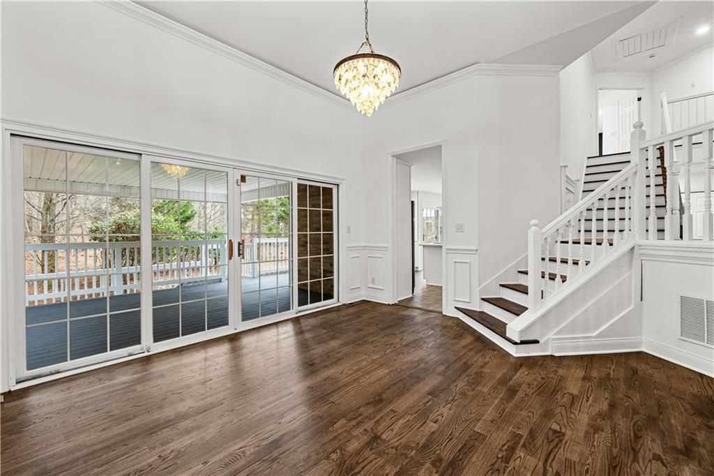 5302 Greenway Drive Villa Rica, GA 30180 - Photo 10 of 79 a view of an empty room with wooden floor and a window
