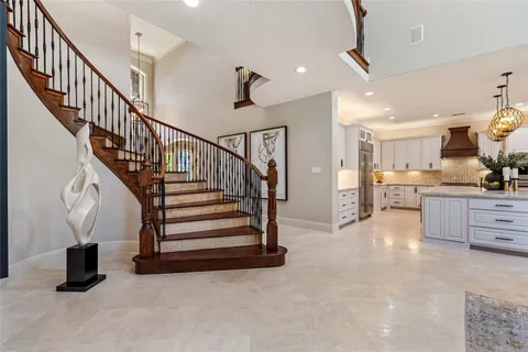 a view of entryway and kitchen