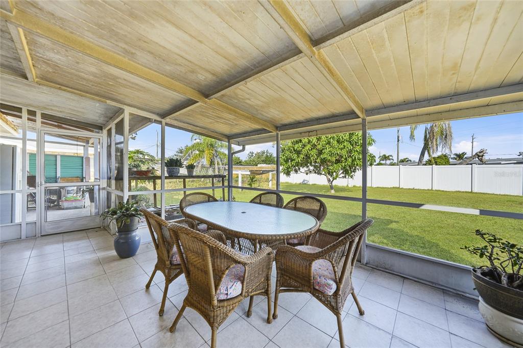 2930 Acline Road Punta Gorda, FL 33950 - Photo 11 of 29 a dining room with furniture and garden view