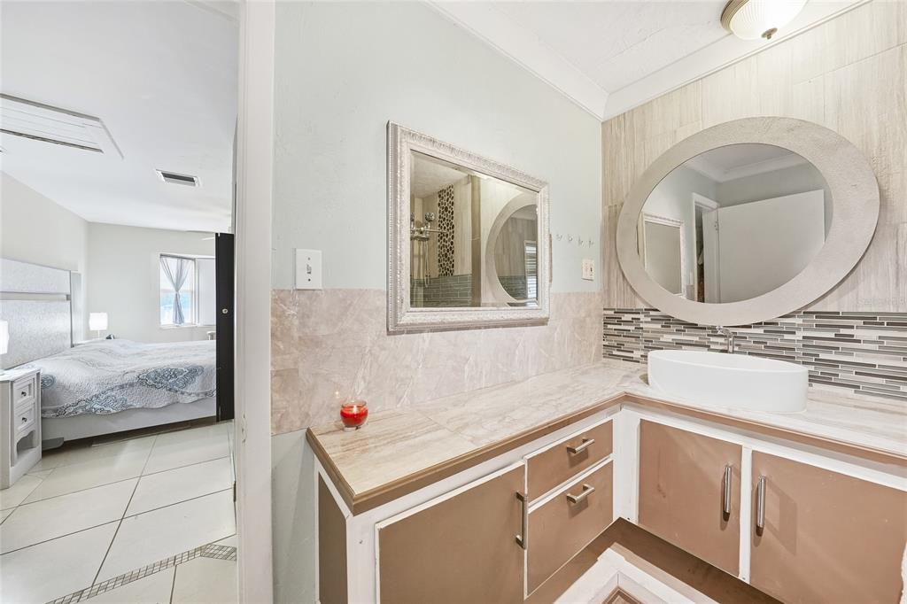 2930 Acline Road Punta Gorda, FL 33950 - Photo 16 of 29 a bathroom with a sink and a mirror