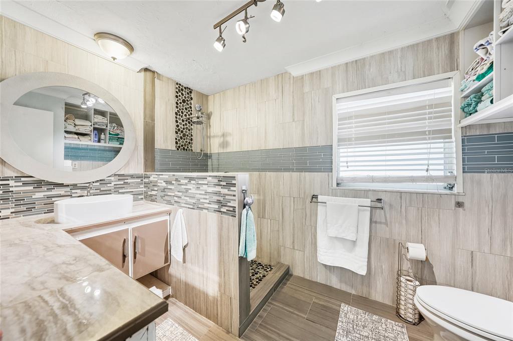 2930 Acline Road Punta Gorda, FL 33950 - Photo 18 of 29 a bathroom with a granite countertop sink and a mirror