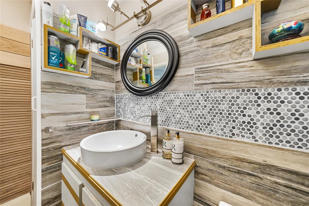 2930 Acline Road Punta Gorda, FL 33950 - Photo 22 of 29 a bathroom with a sink a toilet and a mirror