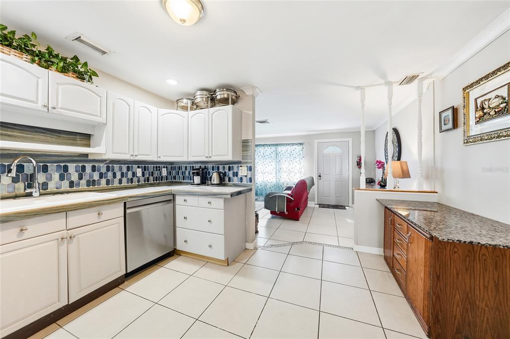 2930 Acline Road Punta Gorda, FL 33950 - Photo 5 of 29 a kitchen with cabinets and appliances