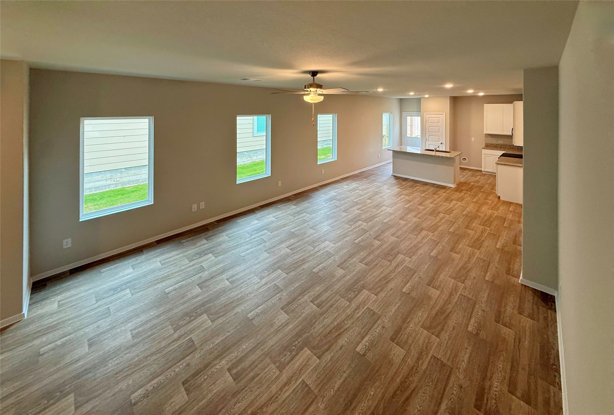 2714 Towy Road Manor, TX 78653 - Photo 21 of 22 An open floorplan living area flows seamlessly into the kitchen, ideal for entertaining.